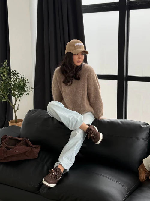 Chocolate-colored sneakers with decorative details