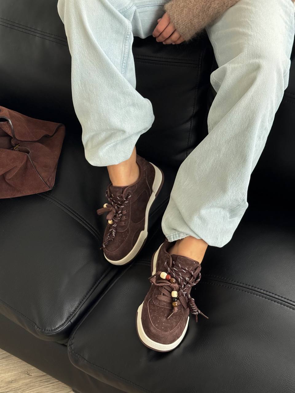 Chocolate-colored sneakers with decorative details