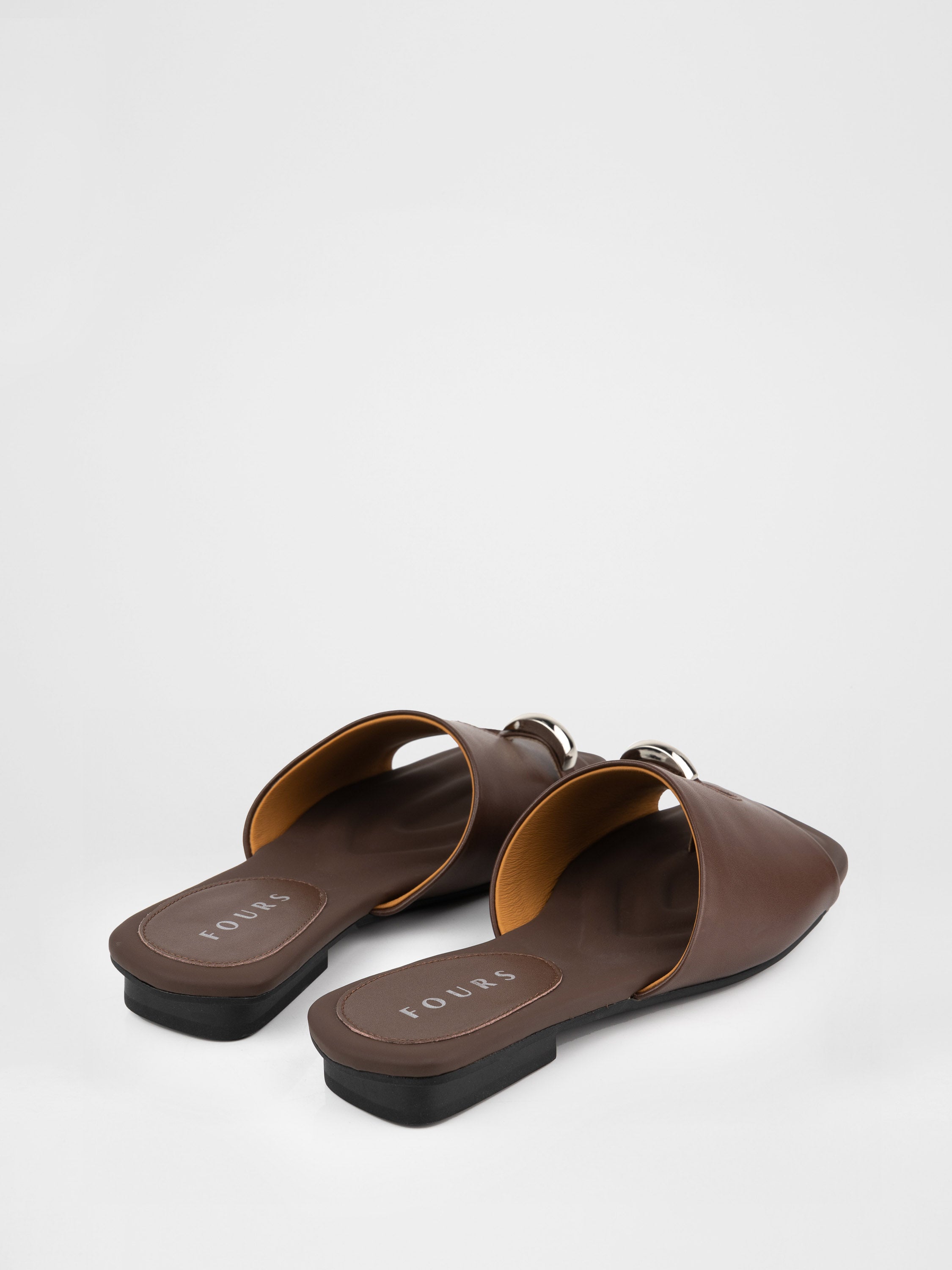 Genuine leather clogs with a decorative metal insert