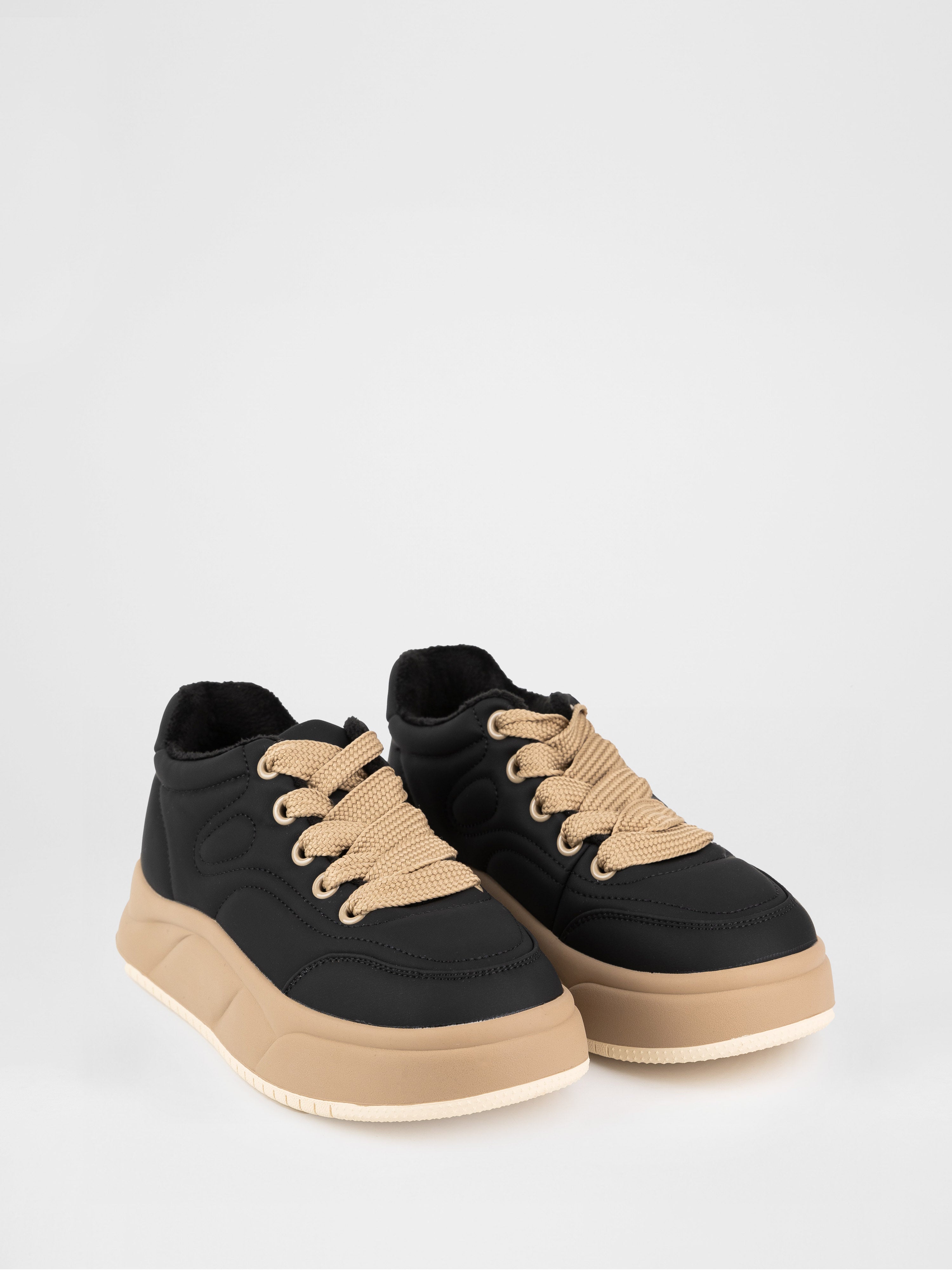 Black sneakers with contrasting sole