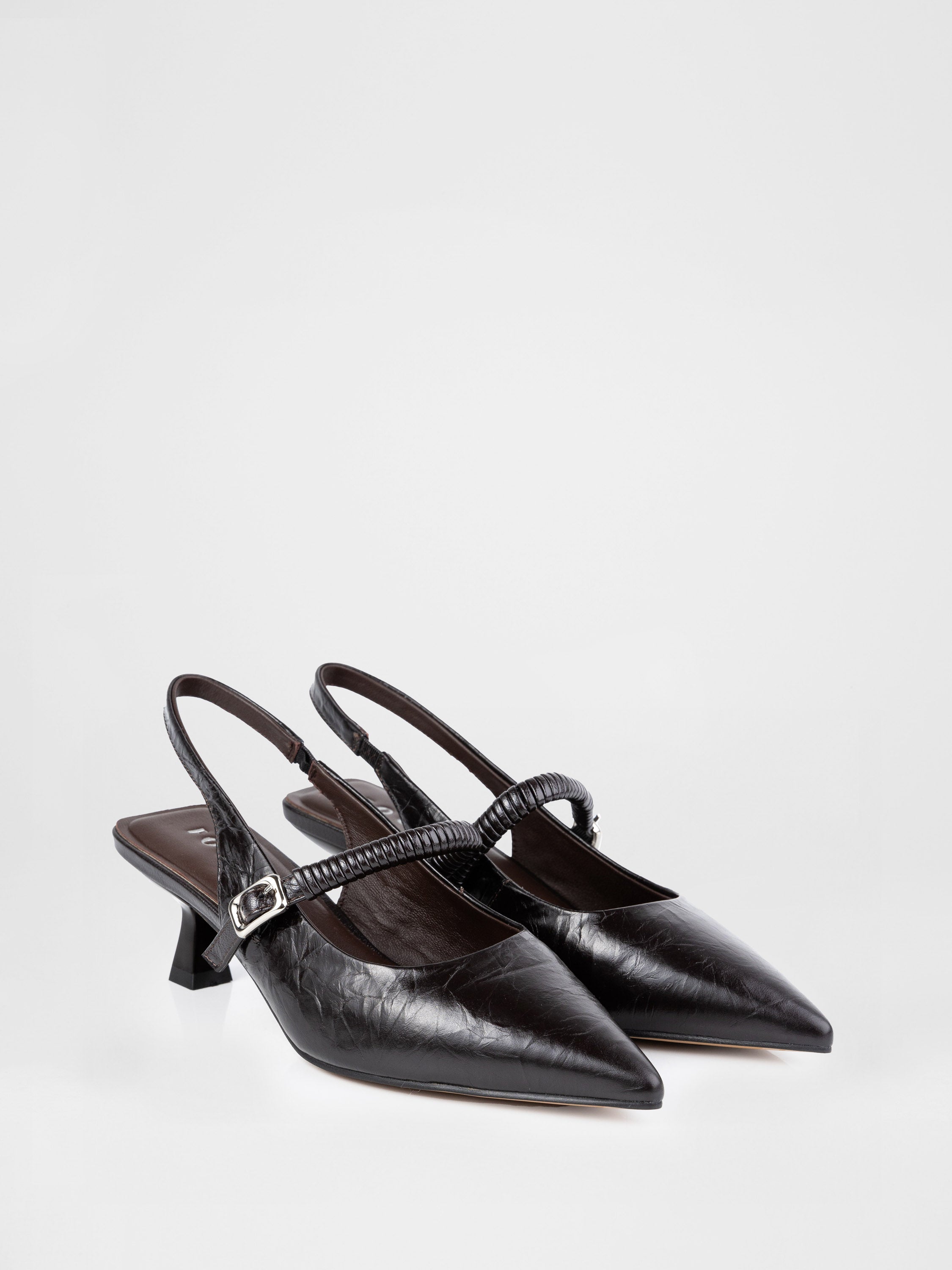 Chocolate-colored patent leather slingbacks