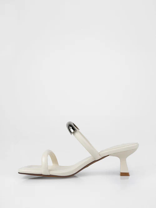 White heeled sandals with a thin strap