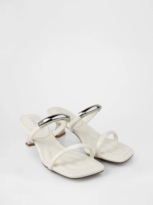 White heeled sandals with a thin strap