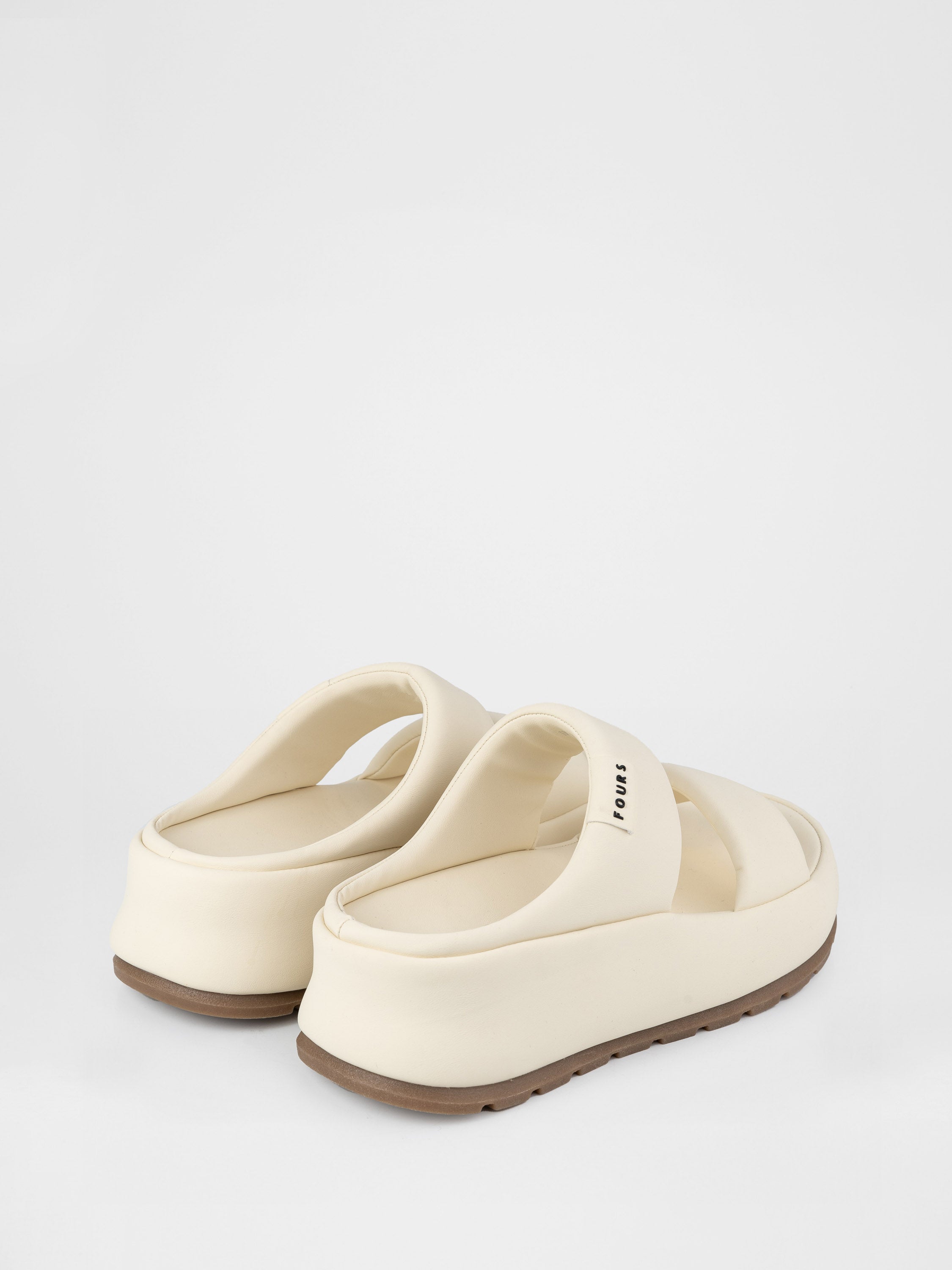Light-colored clogs with thick soles