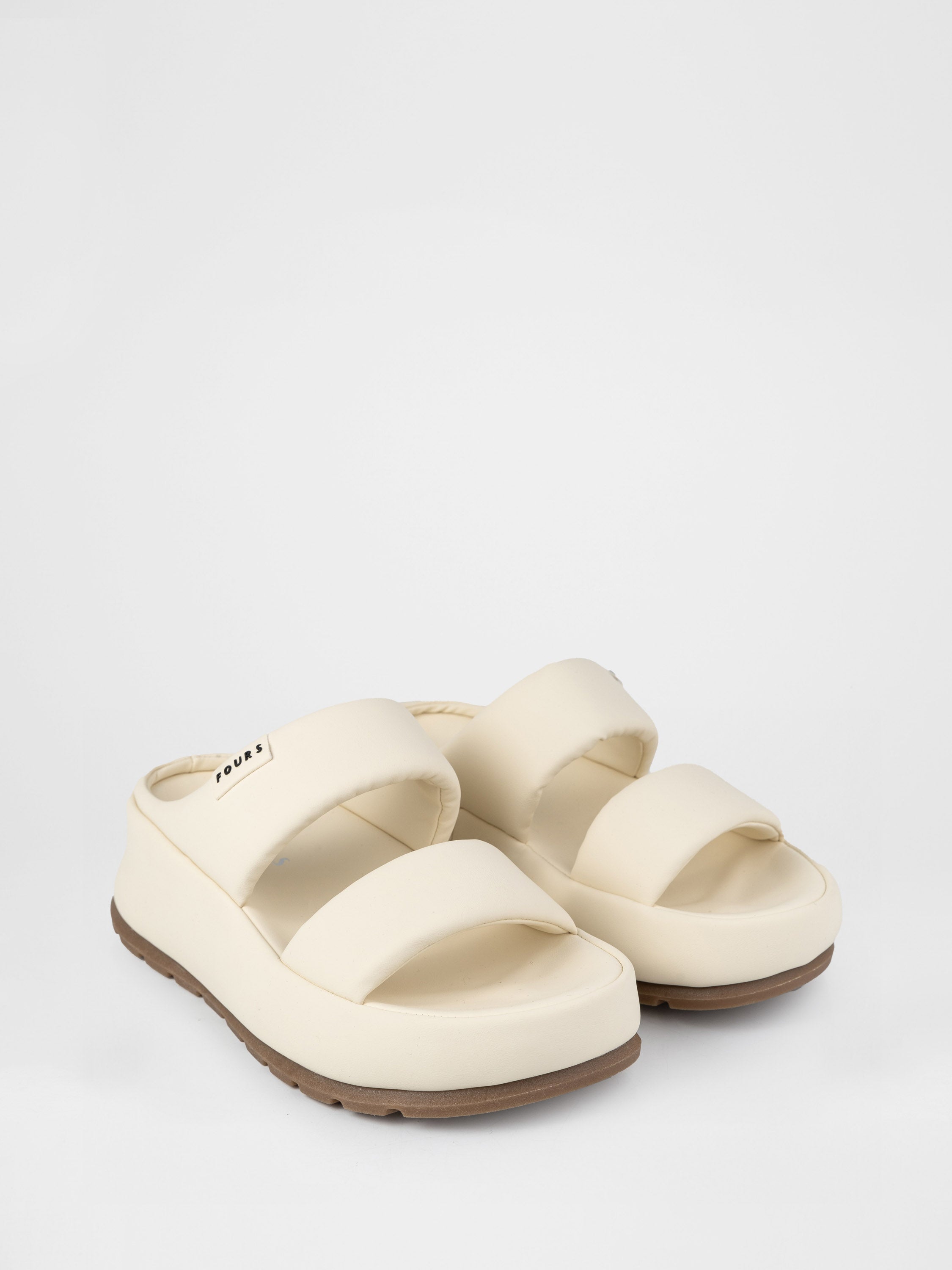 Light-colored clogs with thick soles