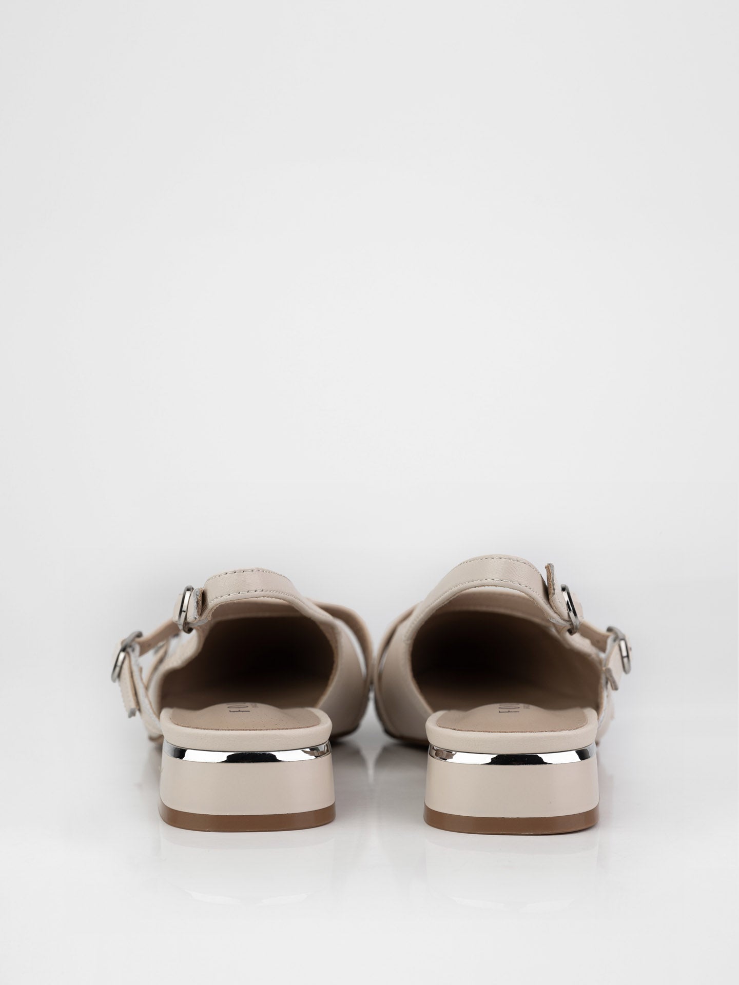 Beige slingbacks decorated with buckles