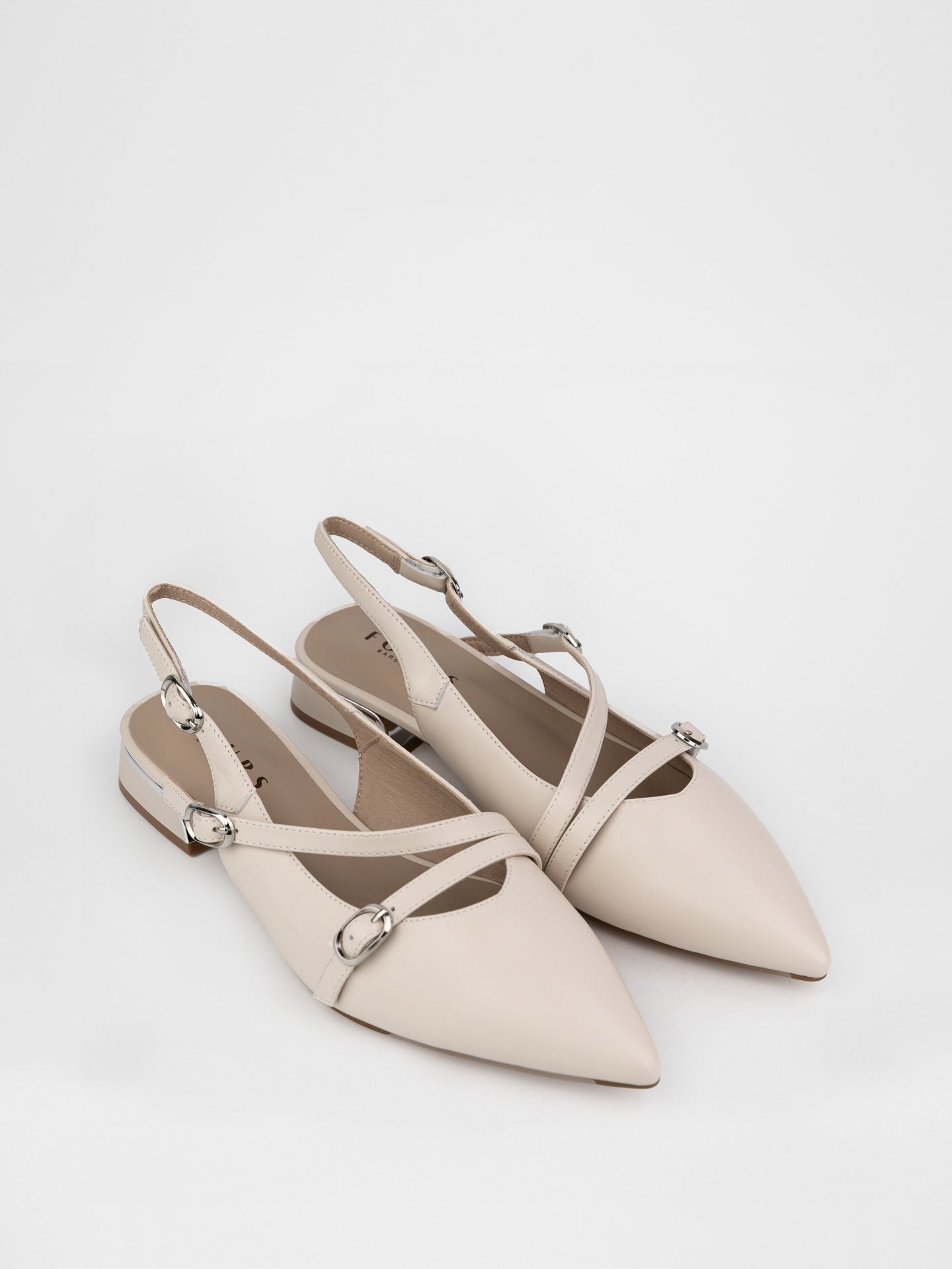 Beige slingbacks decorated with buckles