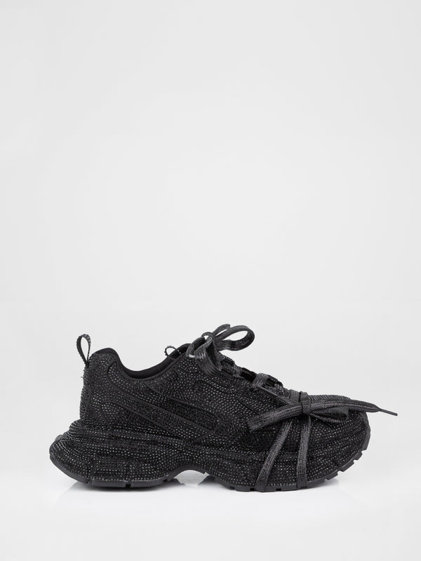 Zapatillas deportivas negras con piedras decorativas