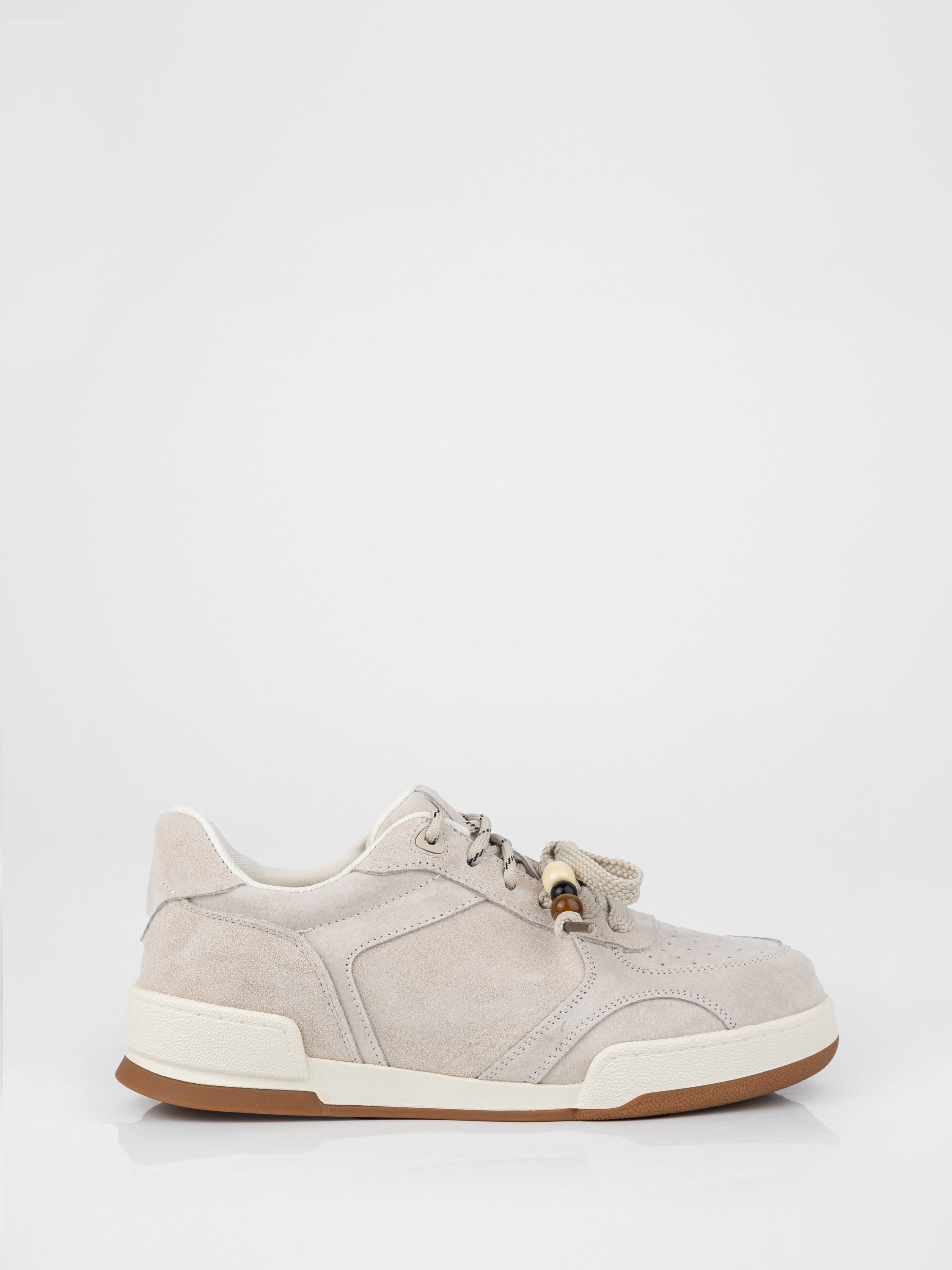 Beige sneakers with decorative details