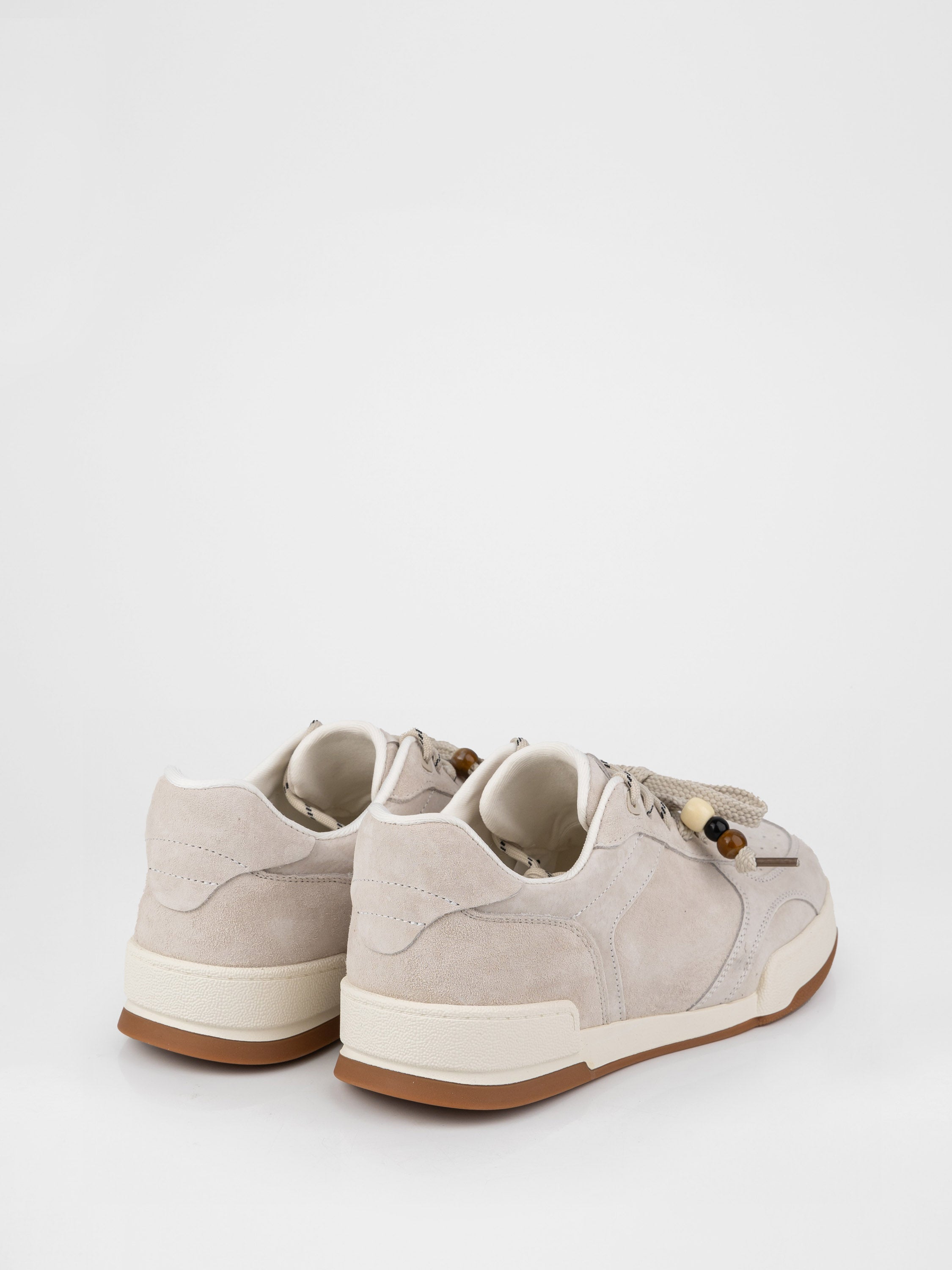 Beige sneakers with decorative details