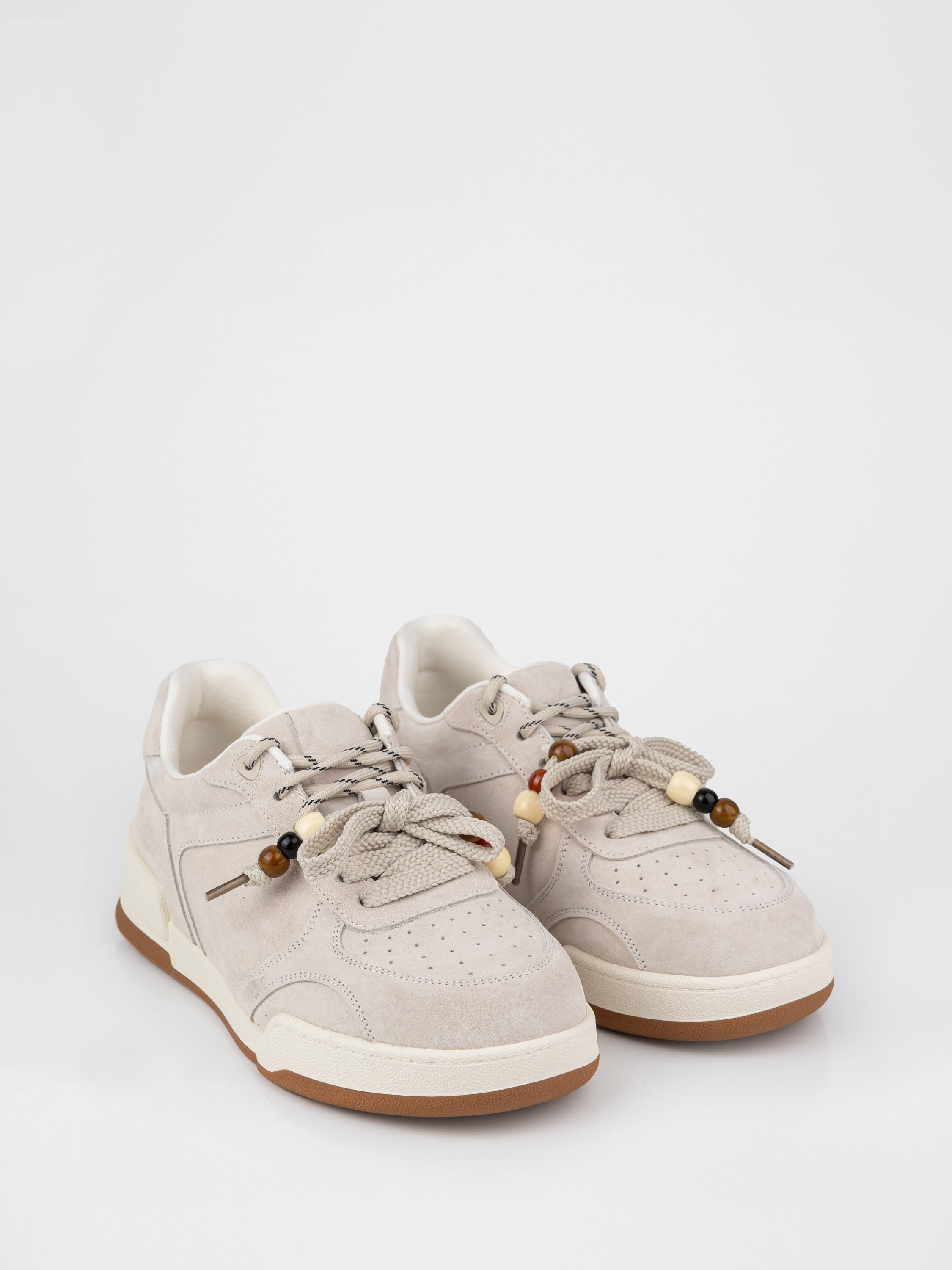 Beige sneakers with decorative details