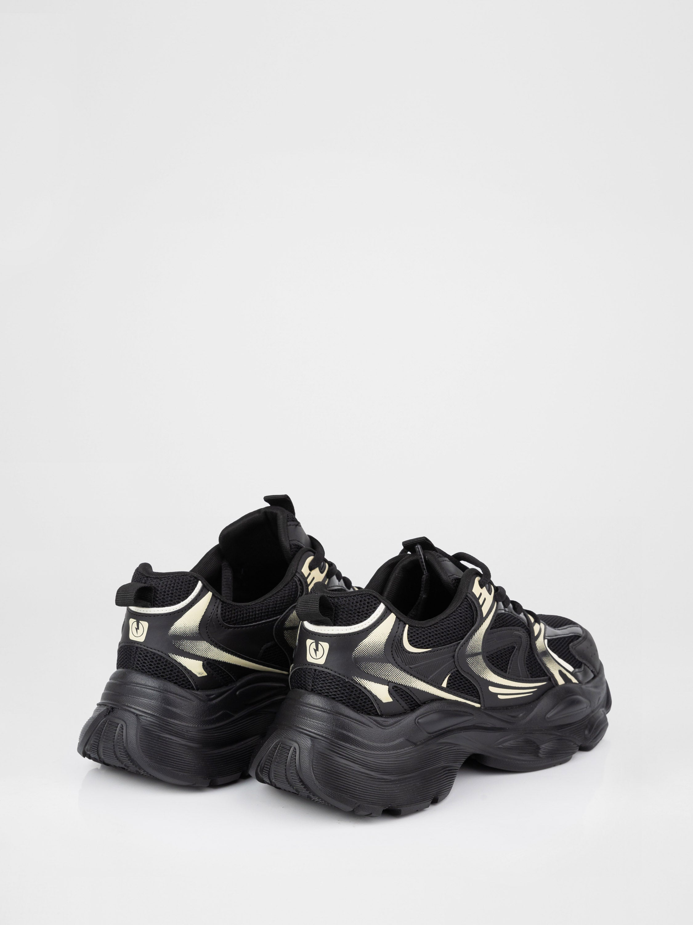 Sneakers in a black-and-white design with a chunky sole
