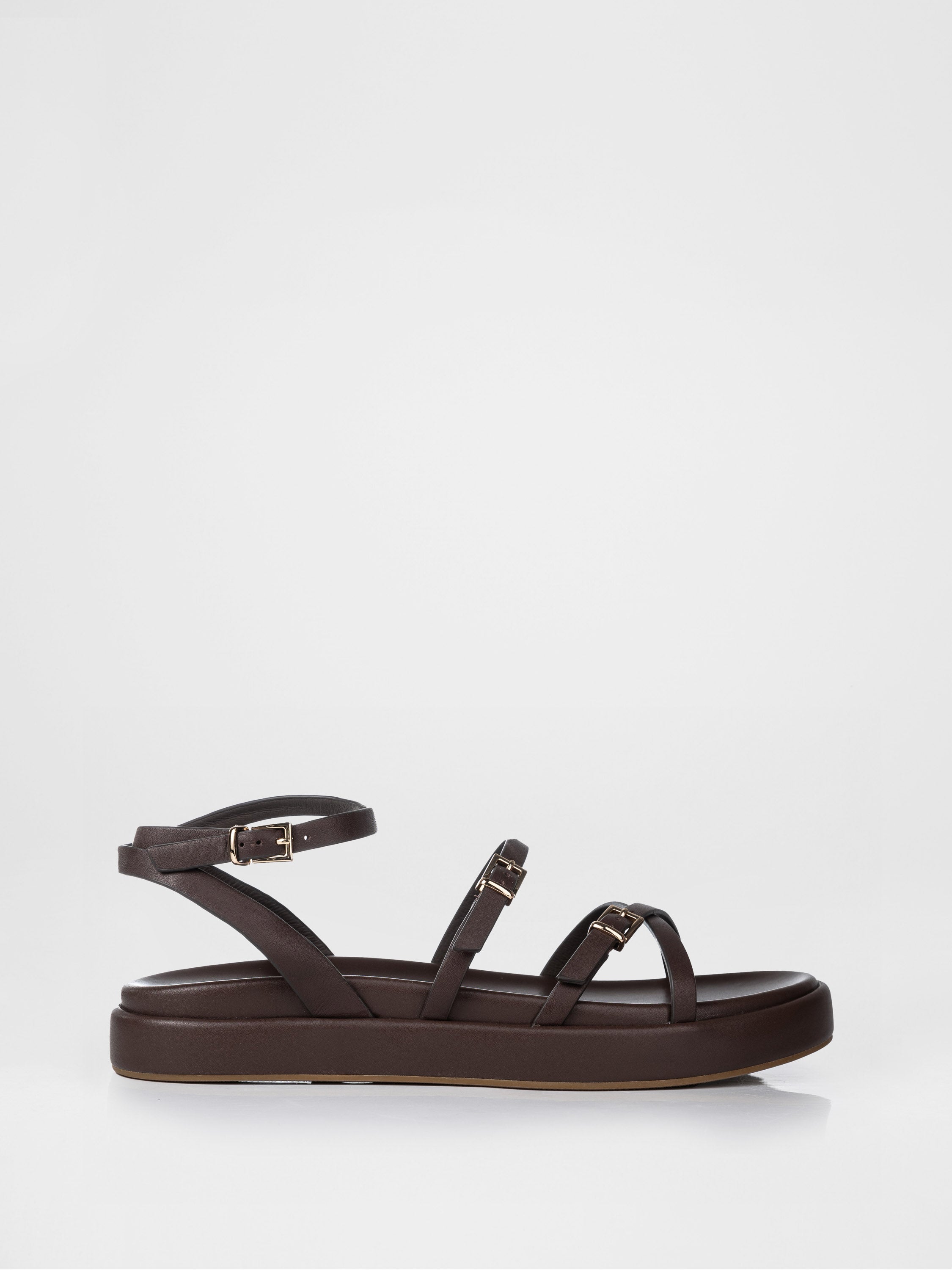 Chocolate-colored sandals decorated with buckles