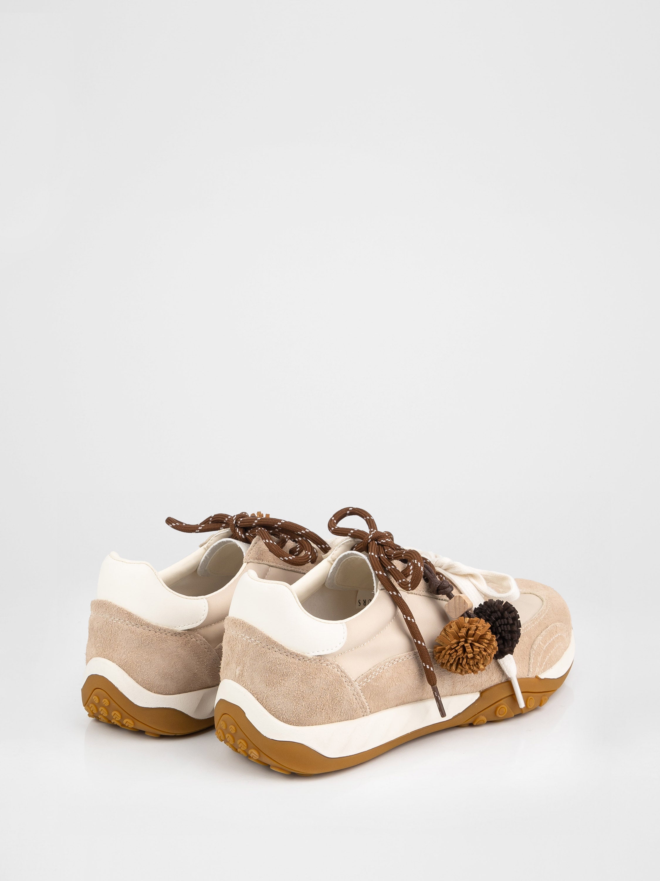 Trendy sneakers in beige