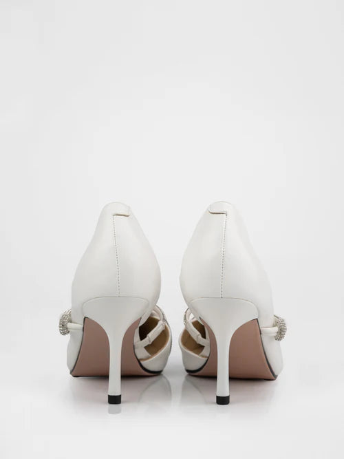 White pumps decorated with rhinestones