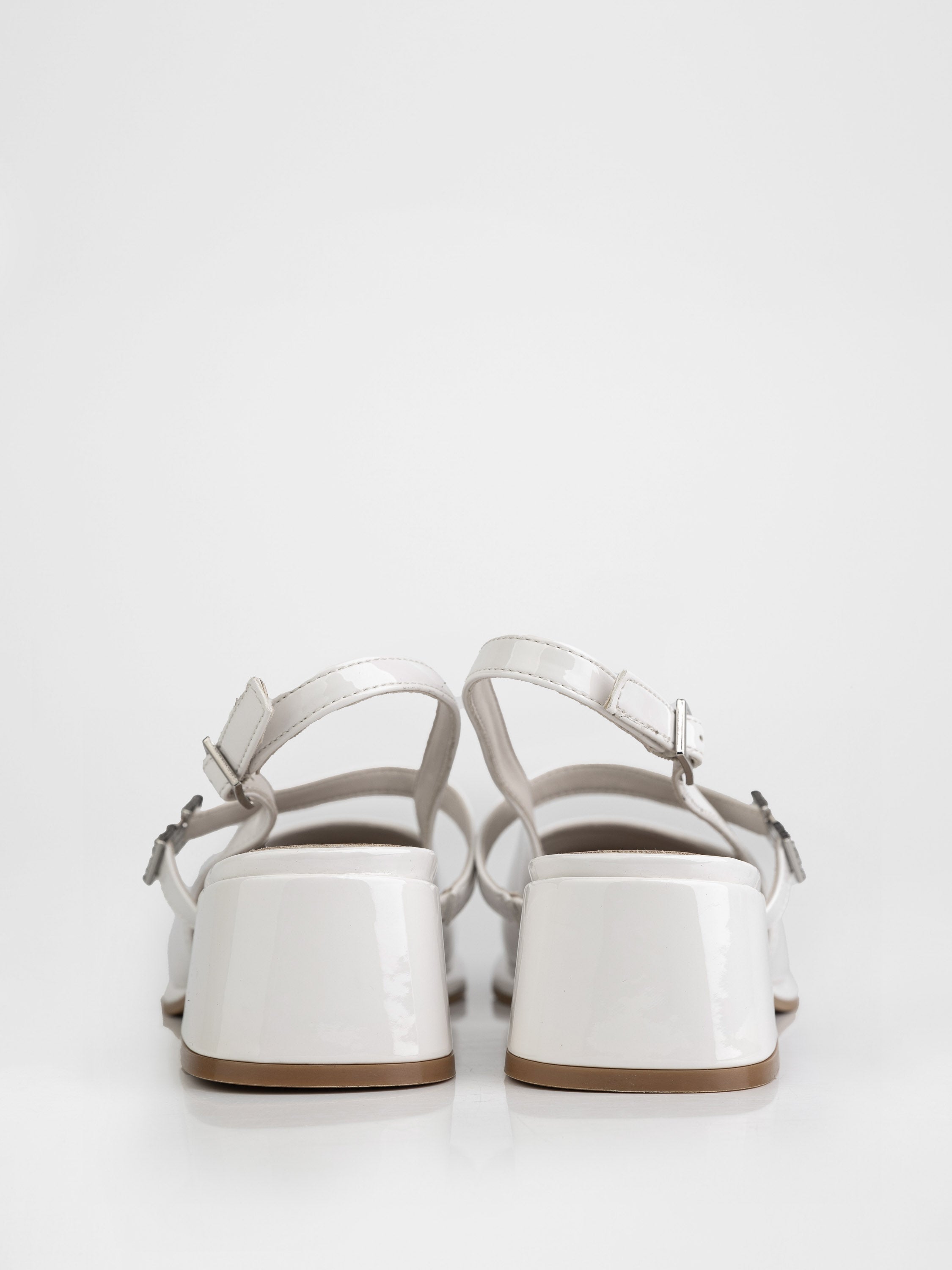 Slingbacks with stable heels in milky color.