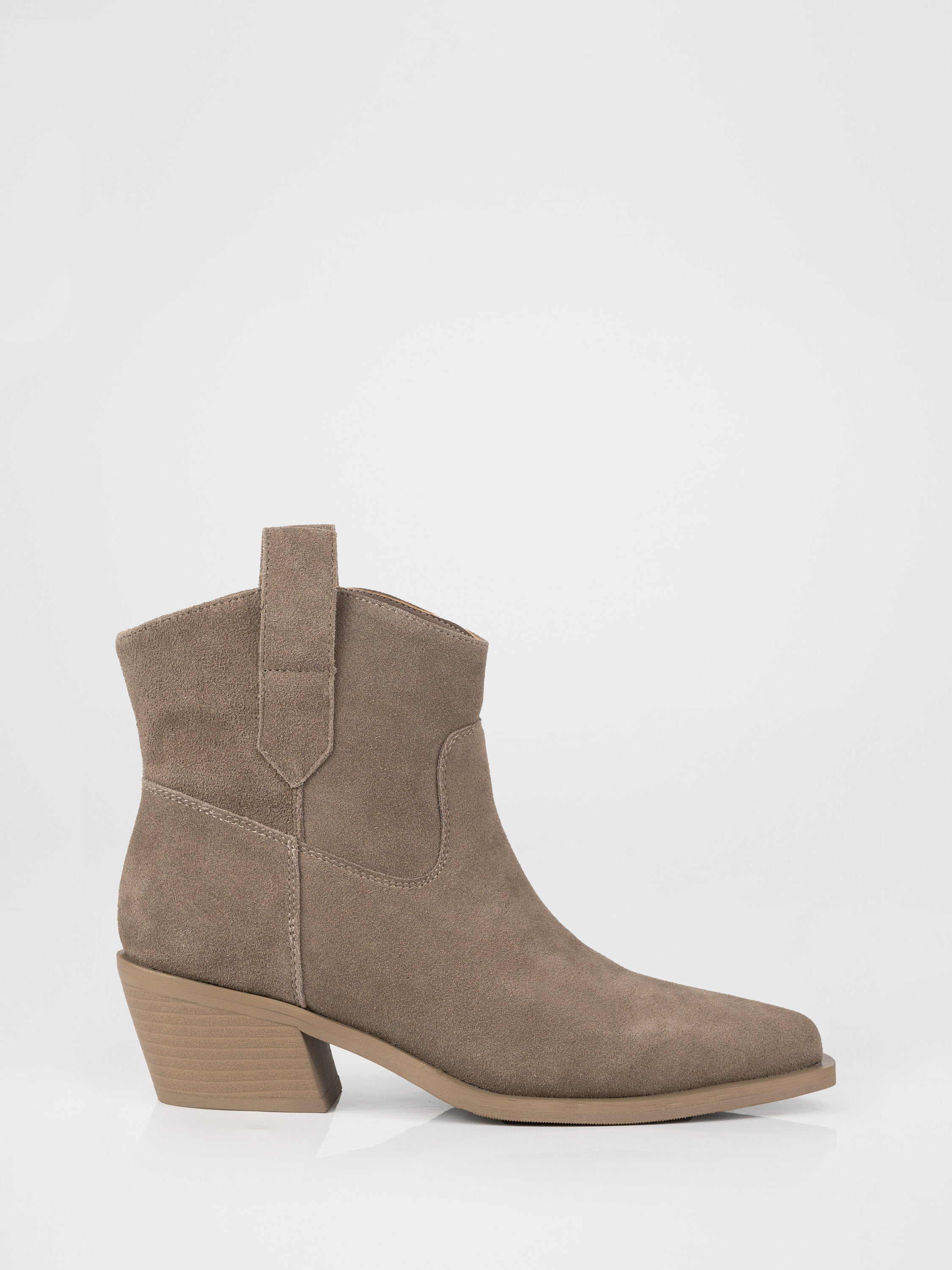 Suede cowboy boots in beige color