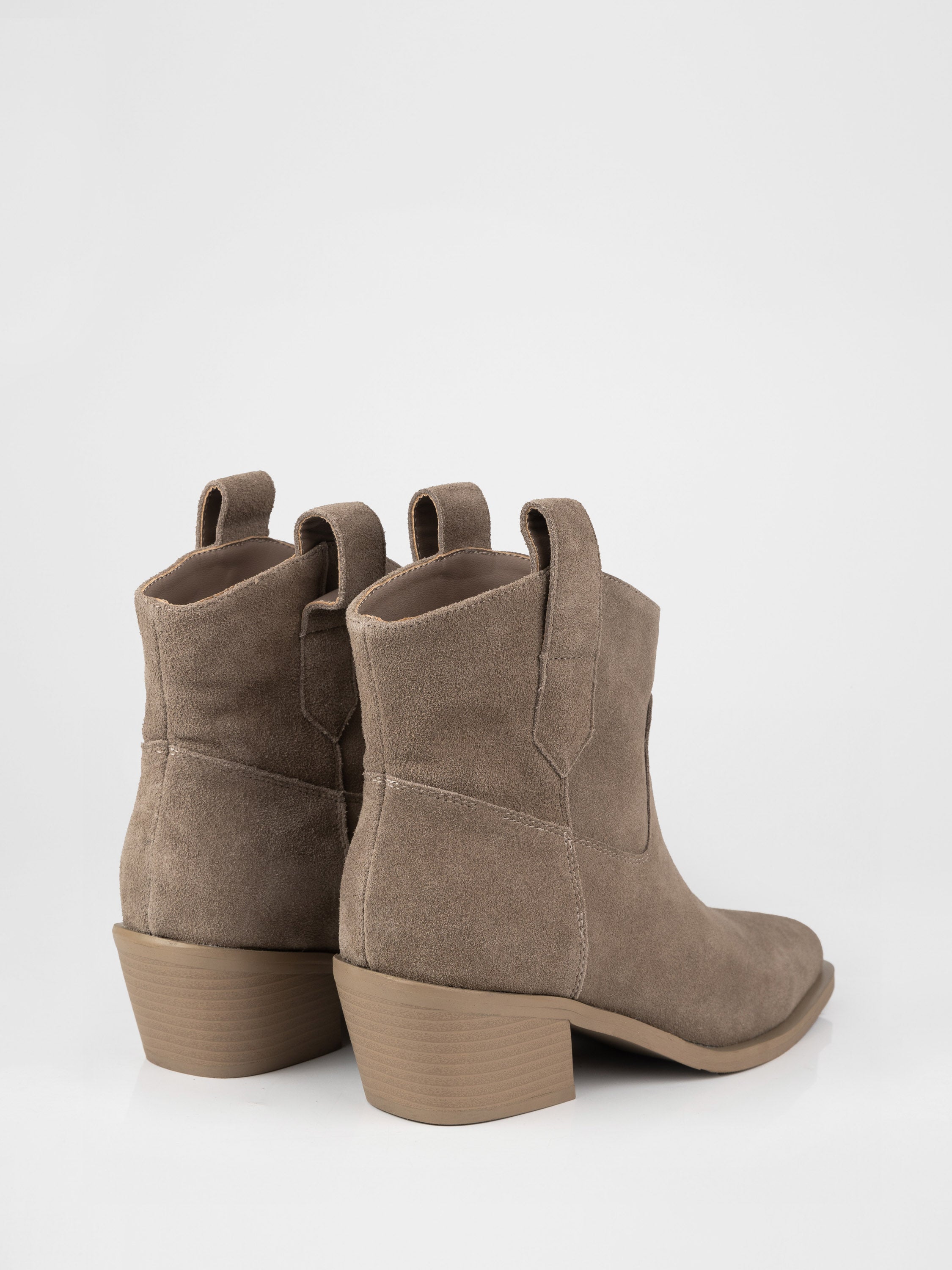 Suede cowboy boots in beige color