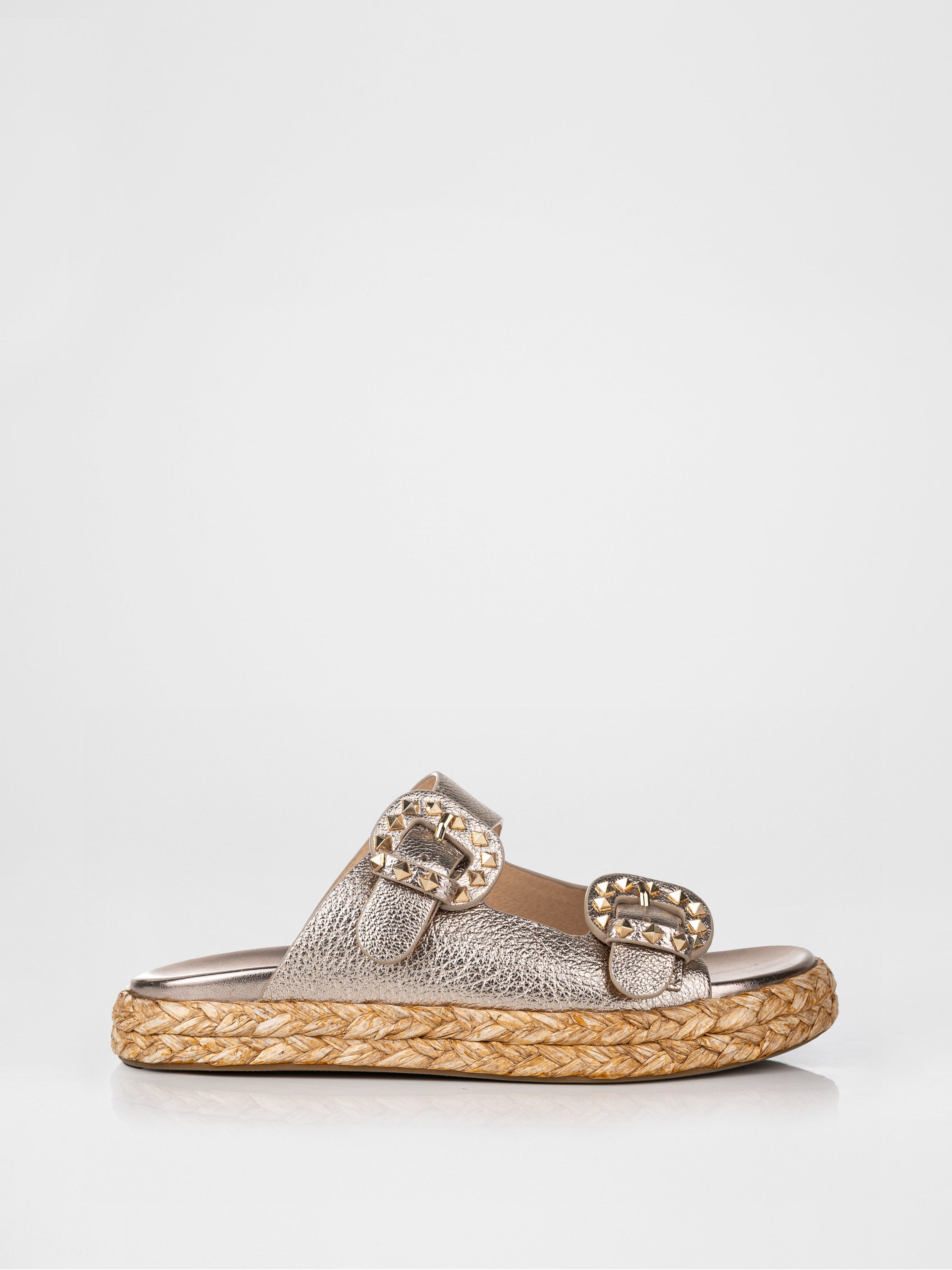 Gold-colored clogs decorated with buckles
