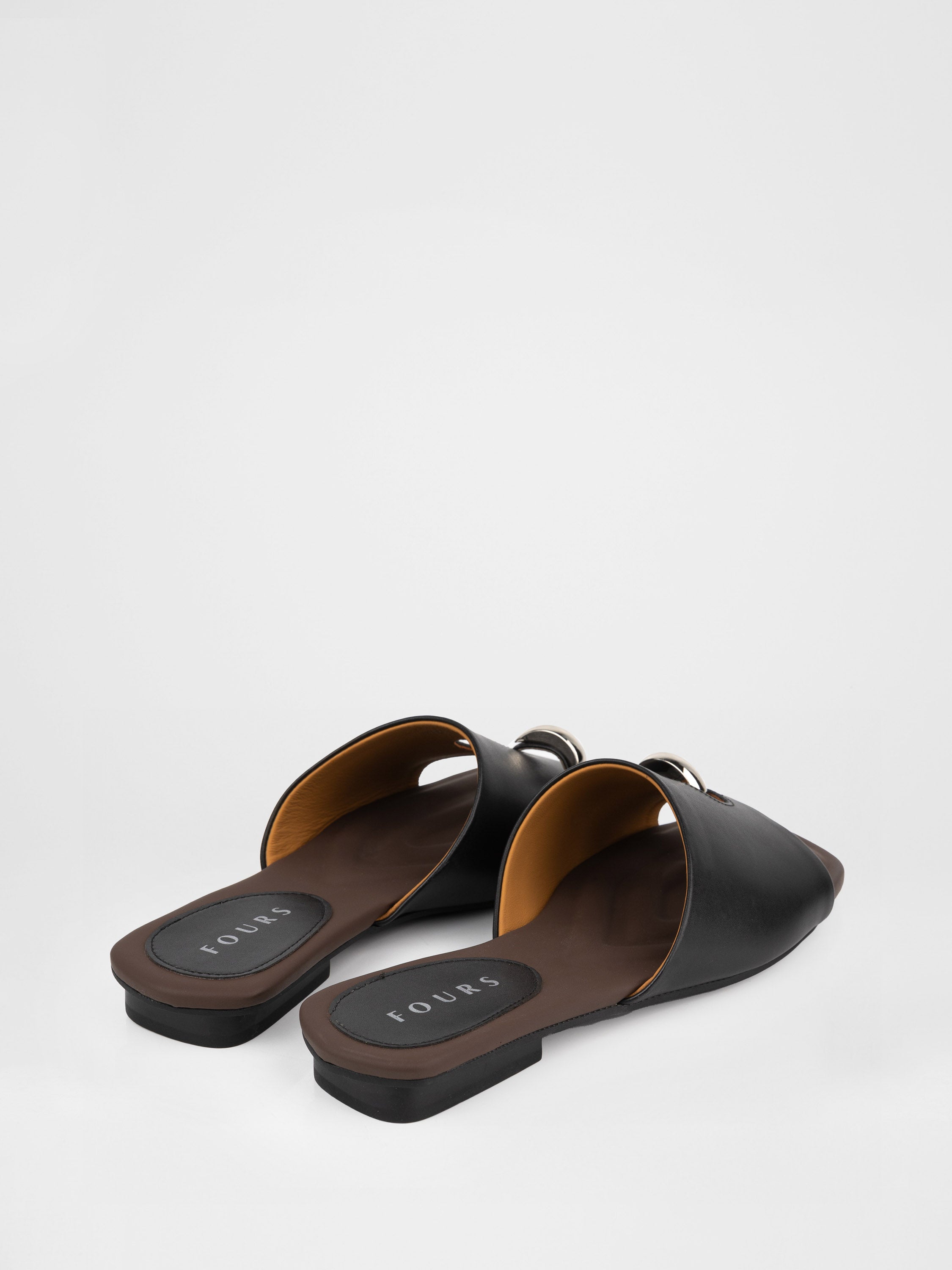 Genuine leather clogs with a decorative metal insert