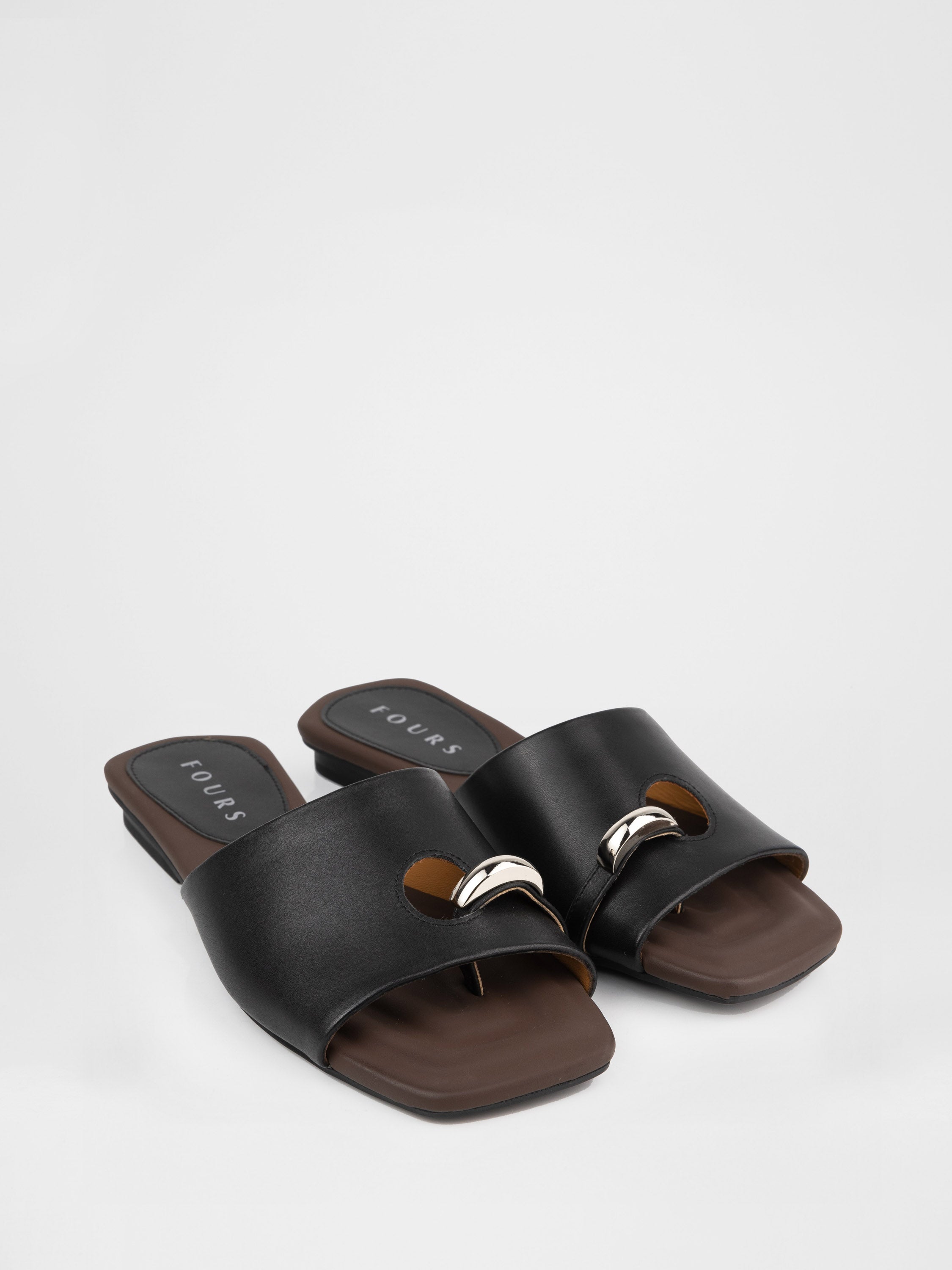 Genuine leather clogs with a decorative metal insert