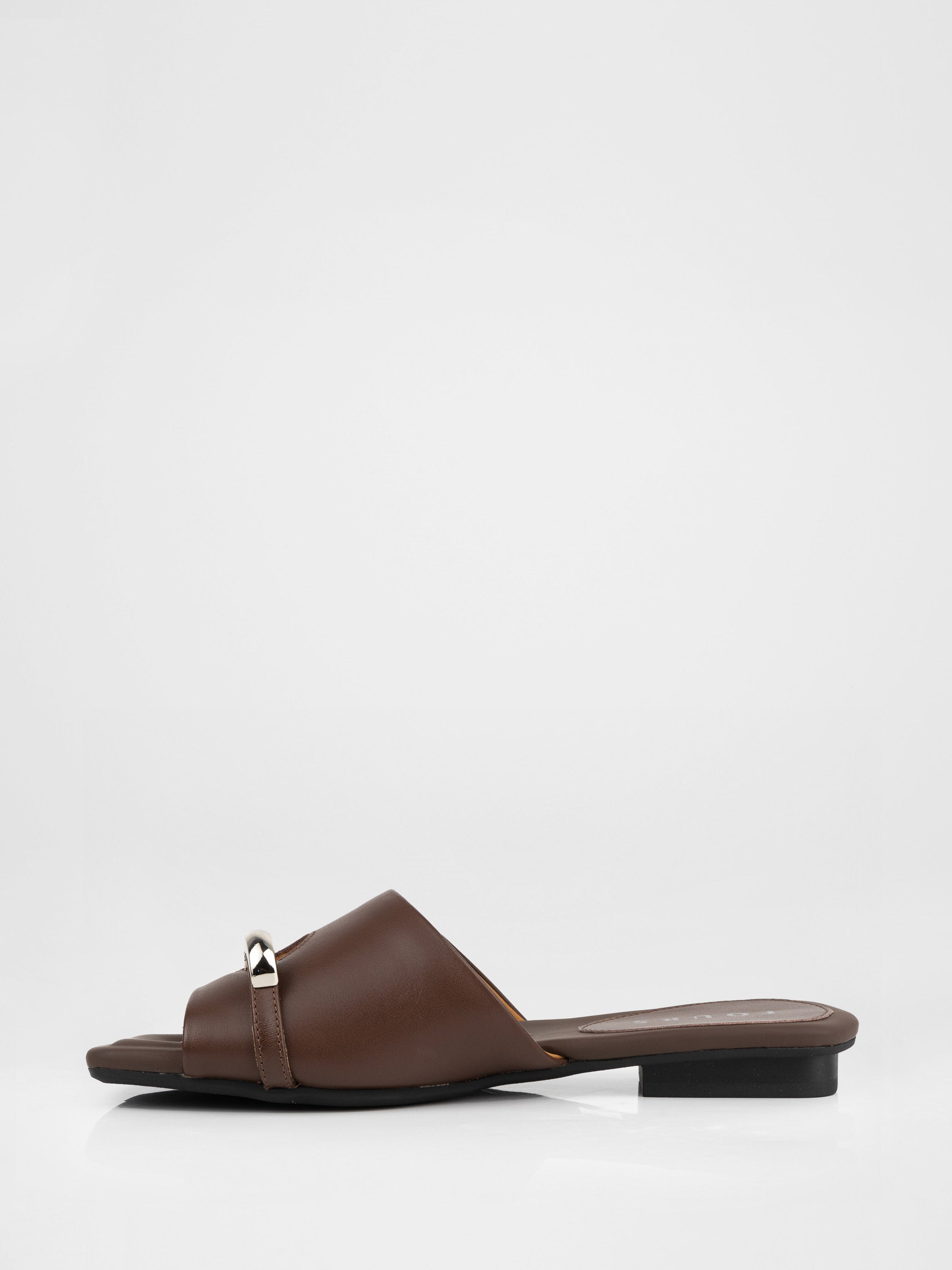 Genuine leather clogs with a decorative metal insert