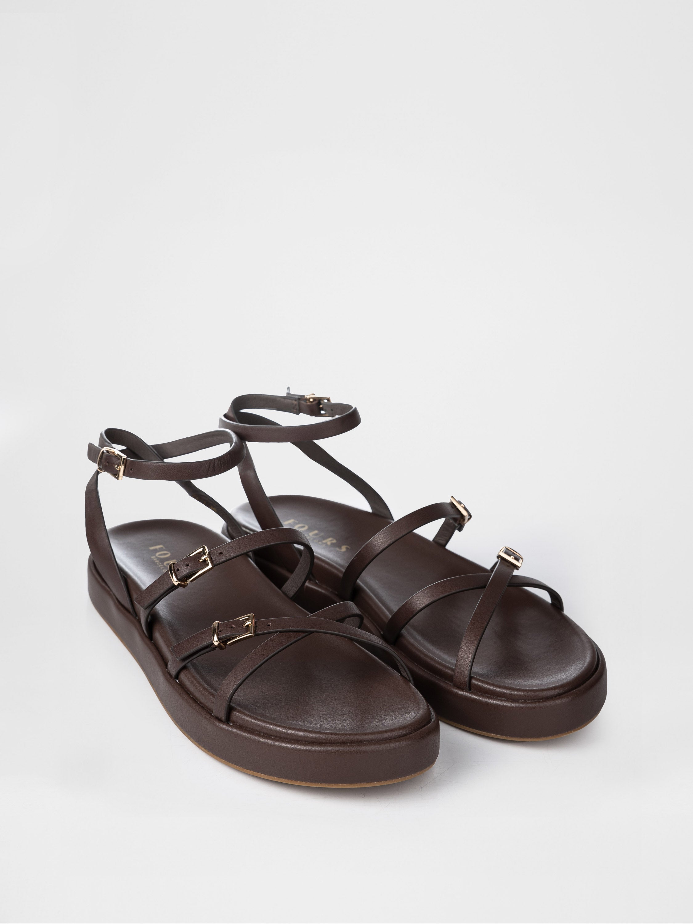 Chocolate-colored sandals decorated with buckles
