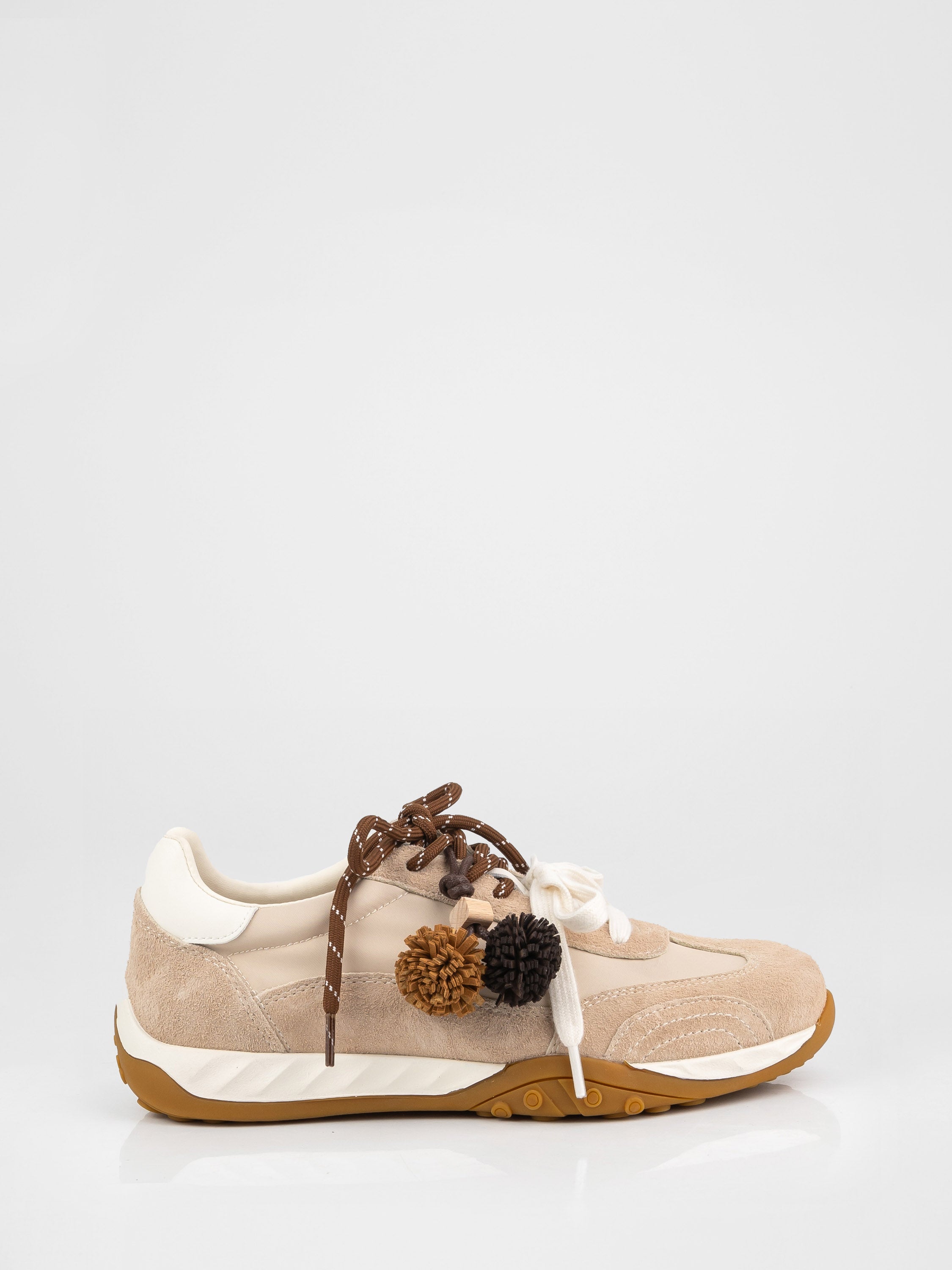 Trendy sneakers in beige