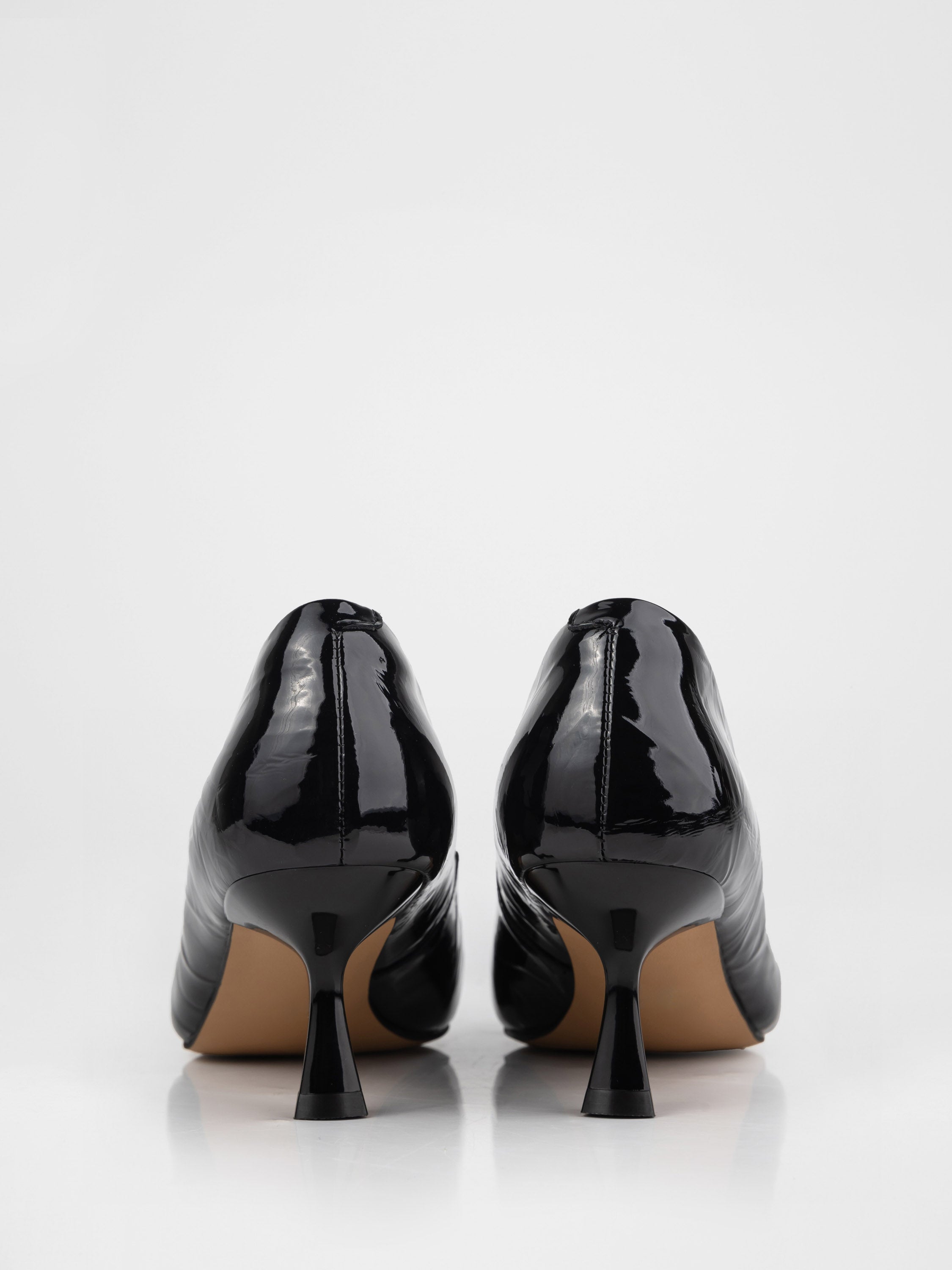 Black pumps with metallic detailing